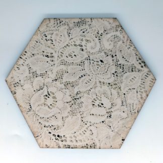 Antique lace textile hex wall tile with soft scalloped floral patterns in cream and sage, UV printed on Baltic birch wood by HexWallTiles