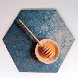Honey dipper in ceramic bowl on teal stone ground pop art hex wall tile, licensed art reproduction, UV printed on Baltic birch wood by HexWallTiles