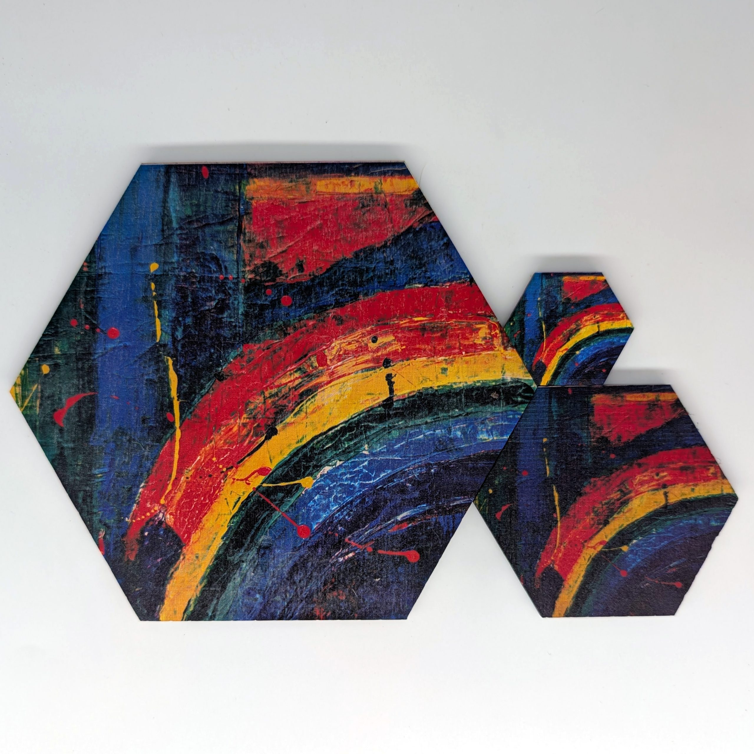 POP037 abstract rainbow pop art hex wall tile shown in three sizes 6 inch 3 inch and 1.5 inch, UV printed on Baltic birch wood by HexWallTiles