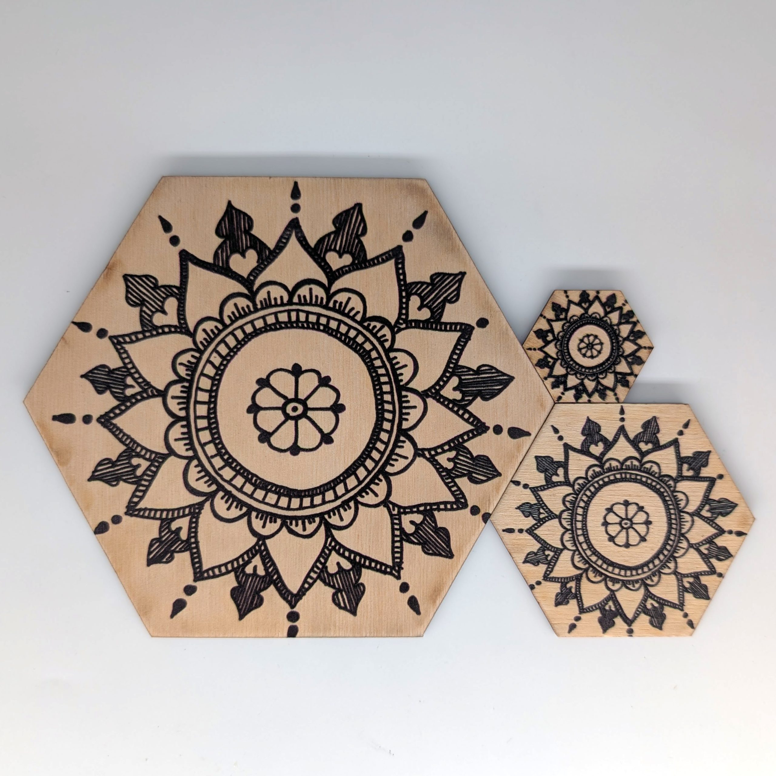 HE001 henna mandala hex wall tile shown in three sizes 6 inch 3 inch and 1.5 inch, UV printed on Baltic birch wood by HexWallTiles