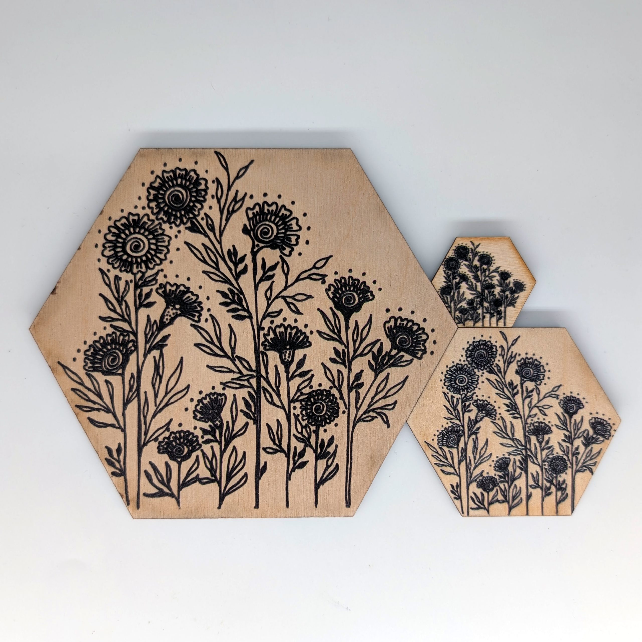 HE007 henna wildflower hex wall tile shown in three sizes 6 inch 3 inch and 1.5 inch, UV printed on Baltic birch wood by HexWallTiles