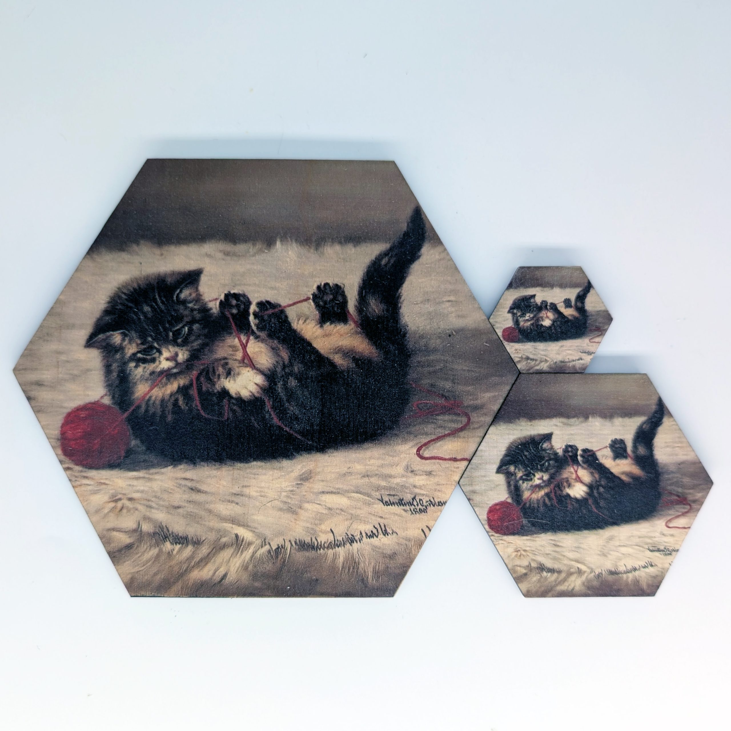 Cat's Cradle kitten hex tile shown in 1.5-inch, 3-inch, and 6-inch sizes